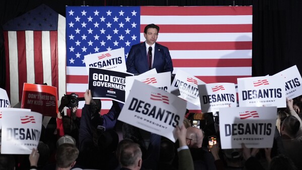 Republican presidential candidate Florida Gov. Ron DeSantis speaks to supporters during a caucus night party on Monday in West Des Moines, Iowa. (AP Photo/Charlie Neibergall)